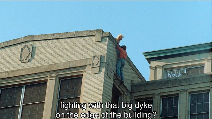 fighting with that big dyke on the edge of the building?